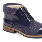 Close-up of the quilted collar and textured tweed panels on the Stuart navy lace boot