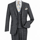 Three-quarter view of men’s charcoal windowpane three-piece suit showing the two-button jacket and matching vest