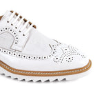 men’s white wingtip brogue dress shoes with contrast sole detail