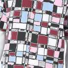 Close up of mosaic square pattern shirt in burgundy, mustard, orange, and white