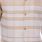 Close-up of beige geometric checkered shirt fabric from Montique walking suit