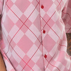 Close up of the red argyle pattern short sleeve walking suit with coordinated shorts