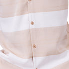 Close up of the tan horizontal stripe short sleeve walking suit set with matching shorts