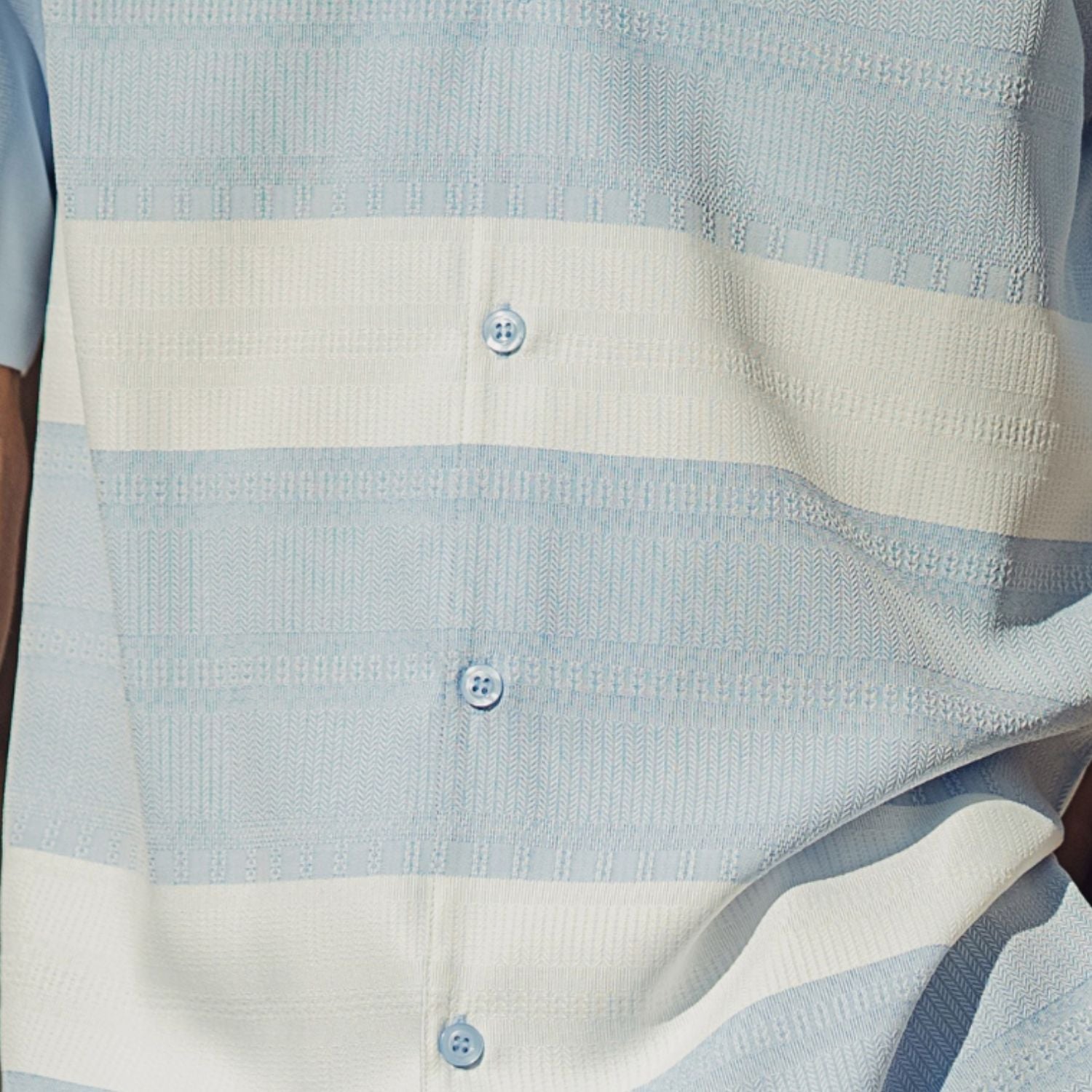 Close up of the Light blue horizontal stripe short sleeve walking suit set with matching shorts
