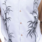 Close up of the Men's tan tropical leaf print walking suit with matching cuffed shorts