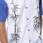 Close up of the Men's royal tropical leaf print walking suit with matching cuffed shorts