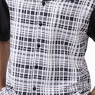Close up of the men's black plaid short sleeve walking suit with matching cuffed shorts