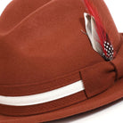 montique cognac fedora with white grosgrain ribbon and feather