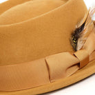 gold pork pie wool felt hat with feather accent by montique