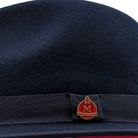 side view navy felt hat with red underside
