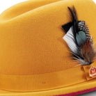 side view gold hat with red underbrim