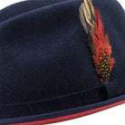 side view navy hat with red underside and feather