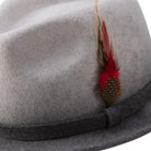 side view of heather grey two tone wool felt hat with feather accent