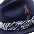 navy felt hat with feather accent and houndstooth band side detail
