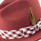 brick wool fedora with matching plaid ribbon and feather detail