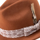 cognac fedora with matching ribbon and feather detail