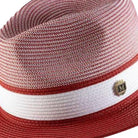 Close up of crimson wide brim straw fedora hat pinch crown