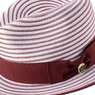 Side view of burgundy striped fedora hat with ribbon band and 2 1/4 inch brim
