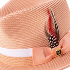 Side view peach fedora hat with feather accent and ribbon band