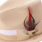 Side view beige fedora hat with feather accent and ribbon band