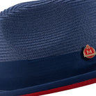 Men’s navy pinch crown fedora hat with red underside brim and Montique pin