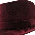 Side view burgundy corduroy fedora hat with narrow brim