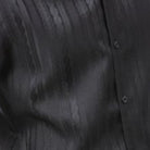 Black tone-on-tone cable knit men's walking suit shirt close-up showing textured pattern