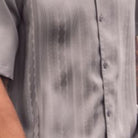 Grey tone-on-tone cable knit men's walking suit shirt close-up showing textured pattern