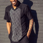 Black polyester men's walking suit short sleeve shirt front view.