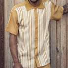 Mustard polyester men's walking suit short sleeve front view showing smooth fabric and matching pants.