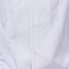 White polyester men's walking suit shirt front close-up showing tonal geometric block panel puff detail.