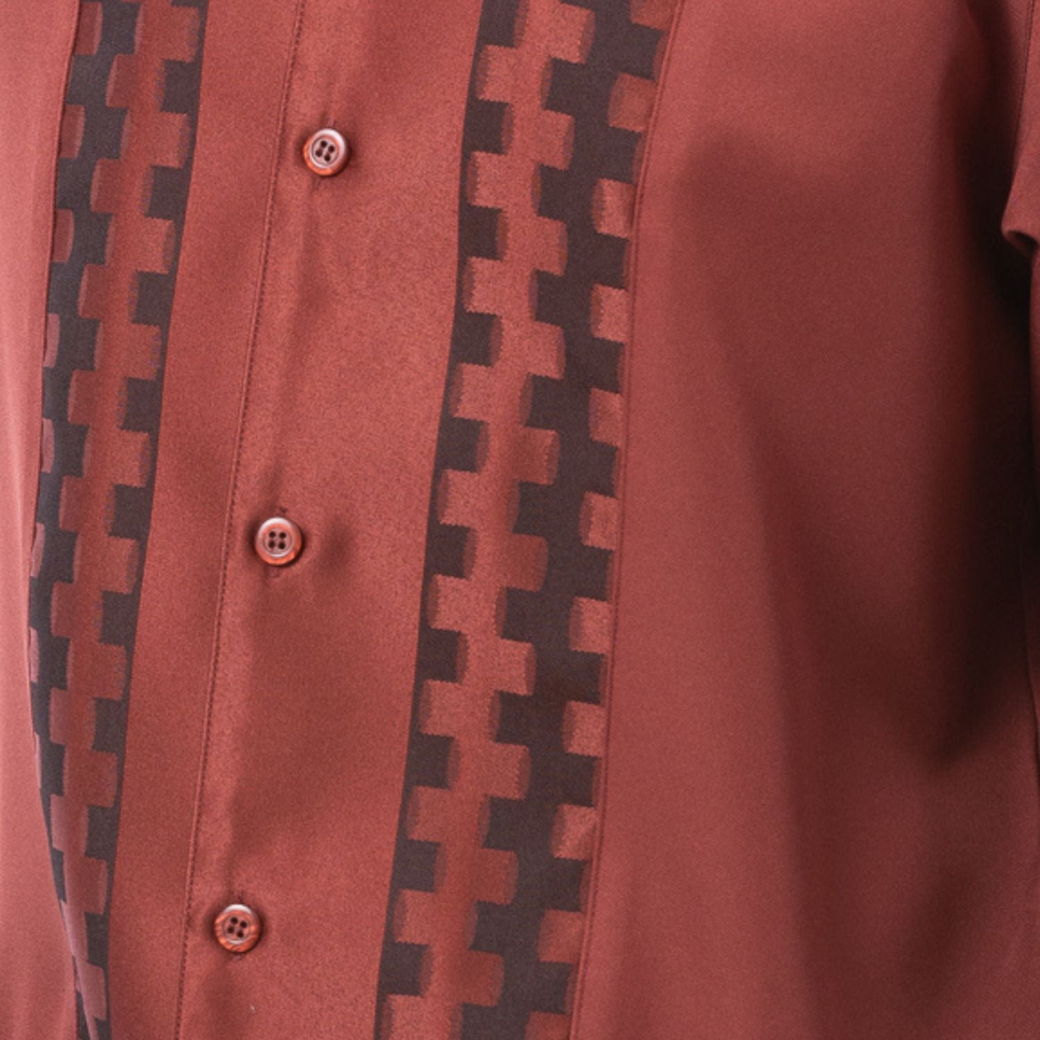 Close-up of cognac walking suit shirt showing the tonal contrast block panels and cuff trim detail.