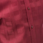Close-up of burgundy walking suit shirt showing the detailed textured tone-on-tone weave pattern.