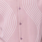 Close-up of blush pink walking suit shirt showing the detailed tonal multi-row puff stitched curved lines.