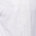 Close-up of cream walking suit shirt showing the detailed tonal multi-row puff stitched curved lines.