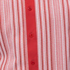 Close-up of red and white woven vertical stripe panel detail on a men's short sleeve walking suit shirt.