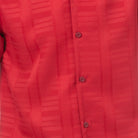 Close-up of red men's walking suit shirt showing the subtle tone-on-tone textured weave pattern.