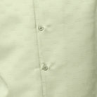 Close-up of mint men's walking suit shirt showing the detailed tonal geometric woven texture.