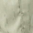 Close-up of mint walking suit shirt showing the detailed tone-on-tone jacquard weave pattern.