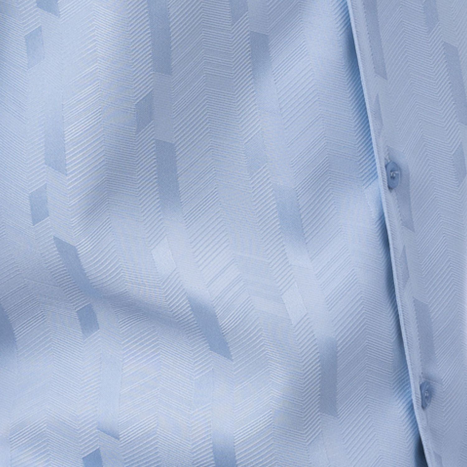 Close-up of sky blue walking suit shirt showing the detailed tone-on-tone jacquard weave pattern.