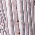 Close-up of cognac walking suit shirt showing the detailed vertical striped pattern in white and grey.