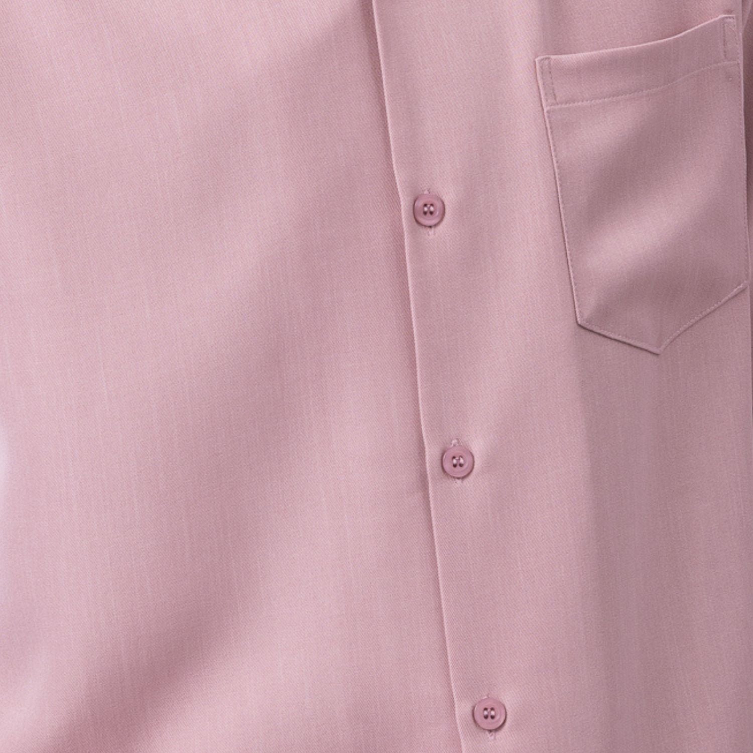 Close-up of blush solid walking suit shirt showing the open collar and clean button-front design.