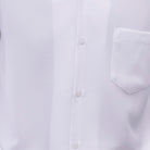 Close-up of white  100% polyester fabric showing the solid texture and button detail
