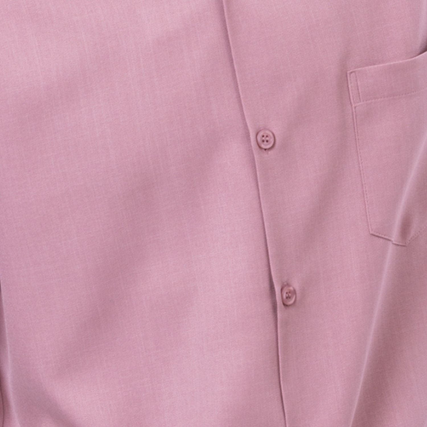 Close-up of rose 100% polyester fabric showing the solid texture and button detail