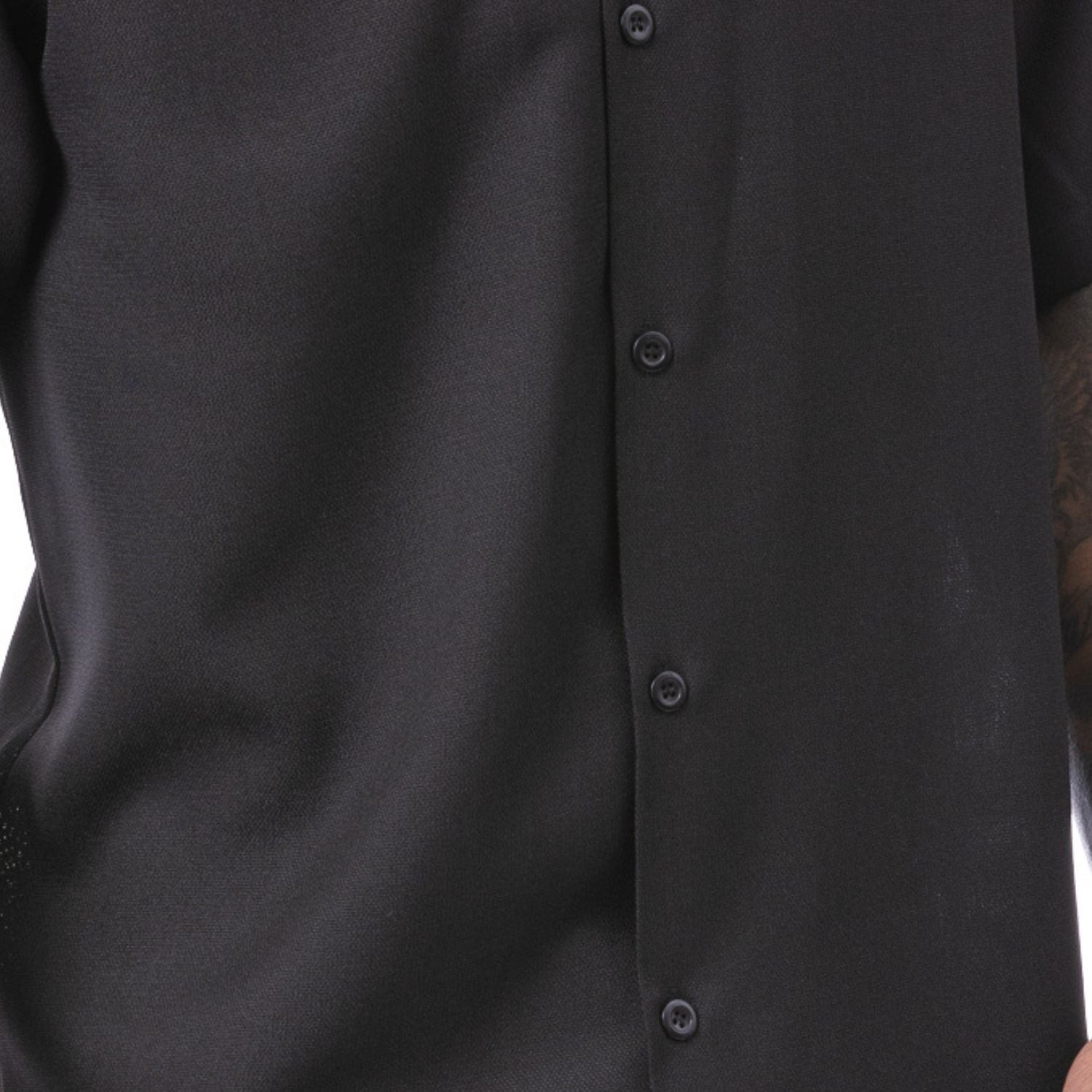 Close-up of black men's walking suit shirt showing the detailed linen-look texture and open collar.