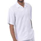 Front view of the white short sleeve walking suit shorts set on a model.