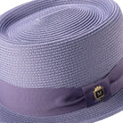 Close-up gunmetal hat band and crest pin