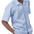 Front profile of the Light blue Azure Sands Collection shirt showing the relaxed fit and short sleeve construction.