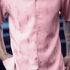 Close-up of the pink walking shirt showing the subtle vertical textured pattern and premium fabric quality.