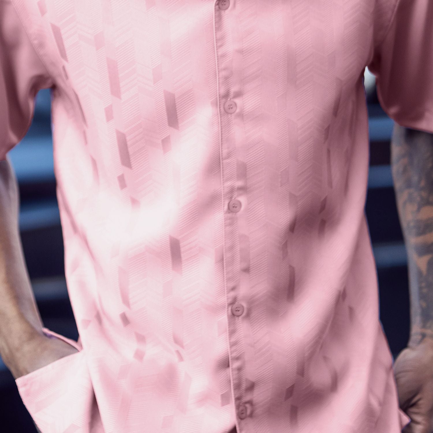 Close-up of the pink walking shirt showing the subtle vertical textured pattern and premium fabric quality.